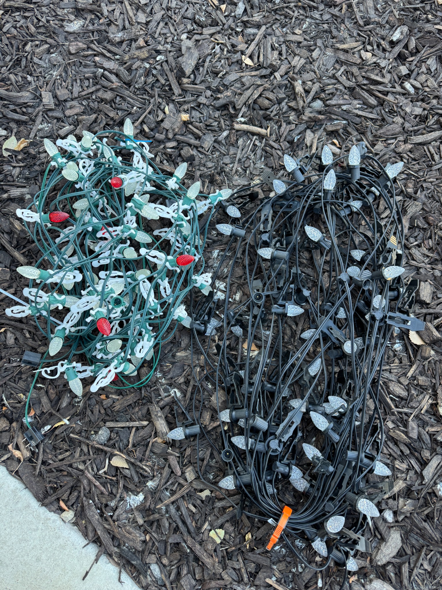 Left: another installer’s green wire, lower-quality bulbs, and clips on the bulb housing. Right: Yuletide Luminary’s matching black socket wire, over-the-bulb clips, and premium LED bulbs.